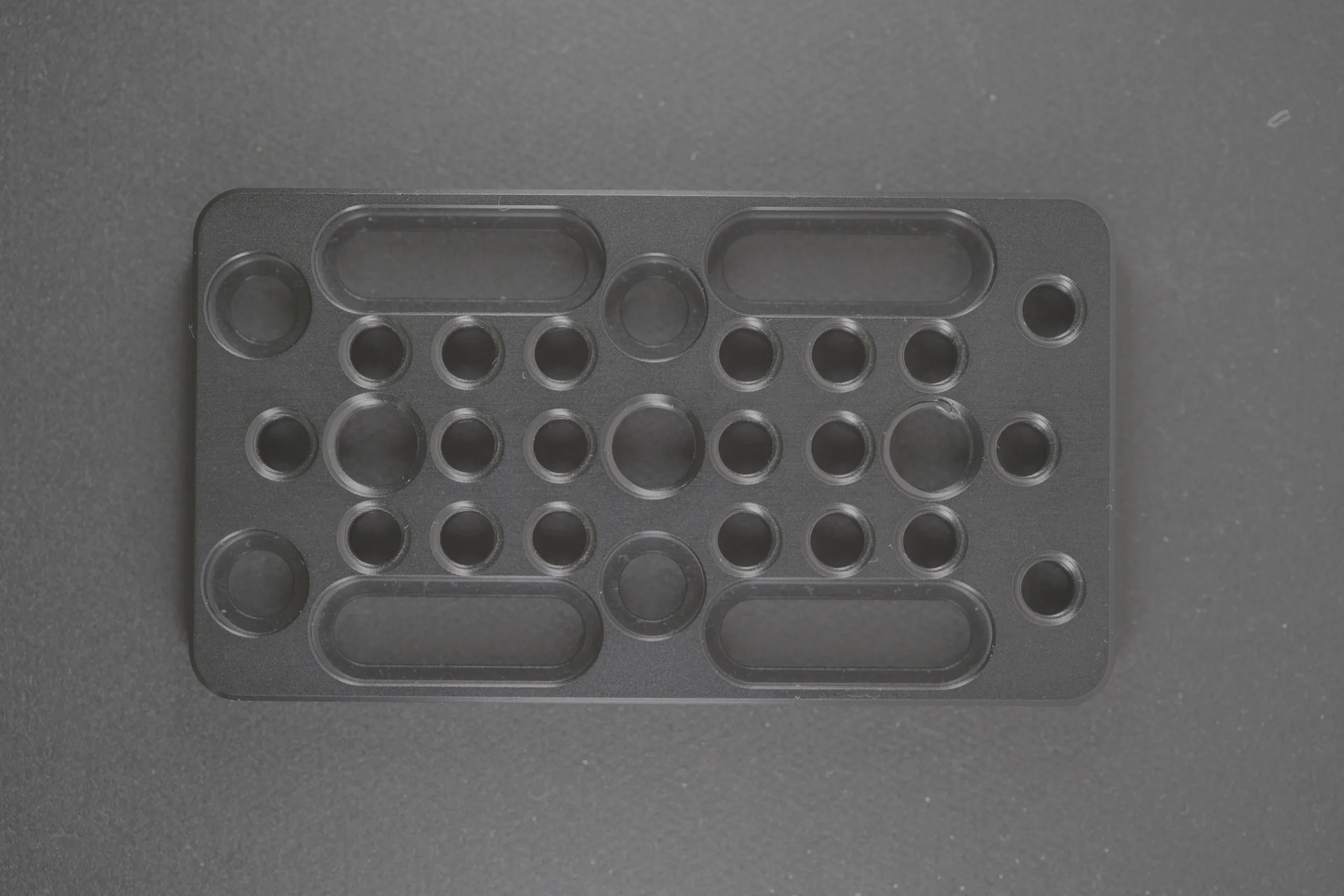 Moulded industrial component with a visible surface scratch.